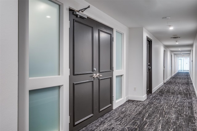 corridor featuring baseboards