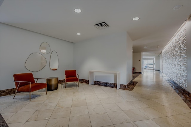 sitting room featuring visible vents and recessed lighting