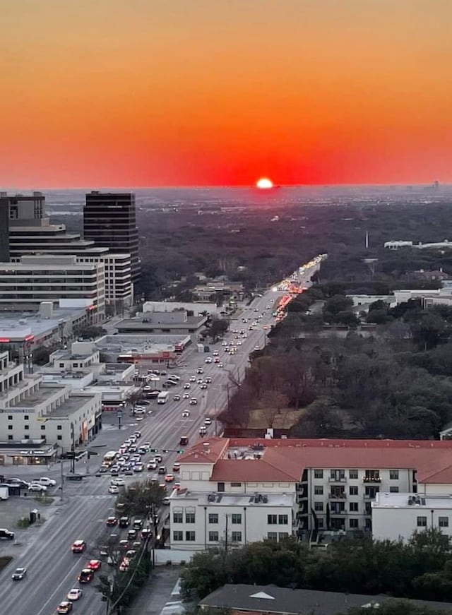 aerial view at dusk with a city view