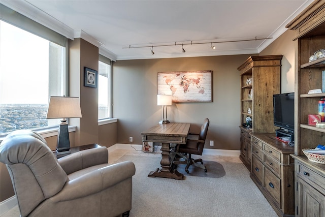 office area featuring light carpet, track lighting, baseboards, and ornamental molding