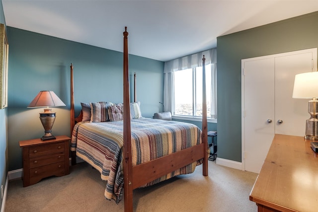 carpeted bedroom featuring baseboards