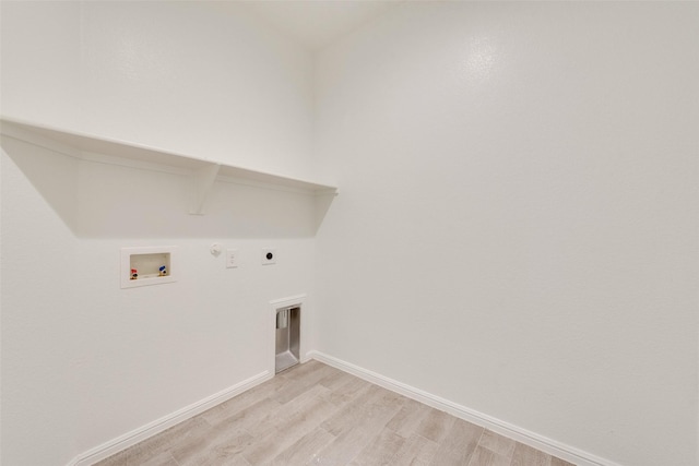 laundry area with light wood finished floors, washer hookup, laundry area, hookup for a gas dryer, and electric dryer hookup