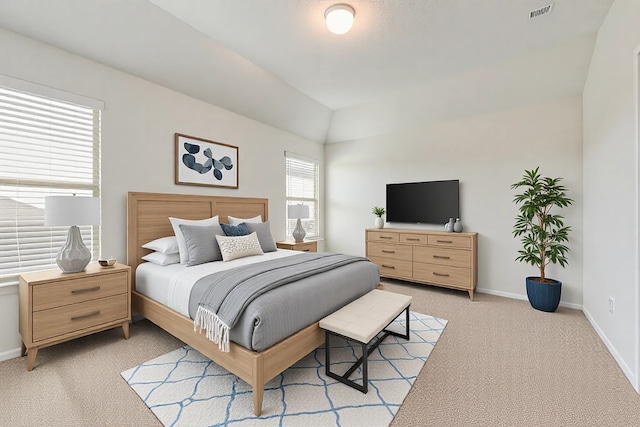 bedroom featuring visible vents, baseboards, and light colored carpet