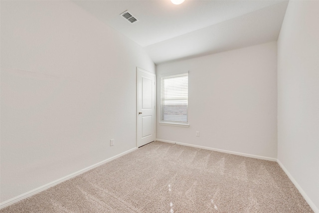 unfurnished room featuring light carpet, visible vents, and baseboards