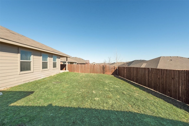 view of yard featuring a fenced backyard