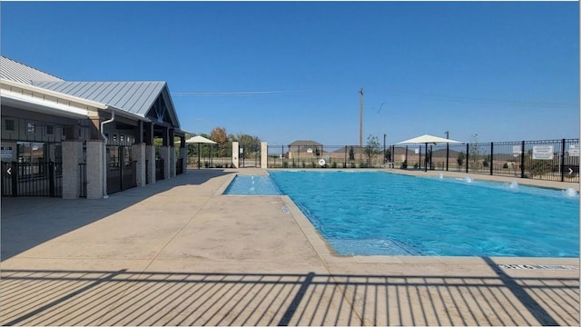 view of pool with fence