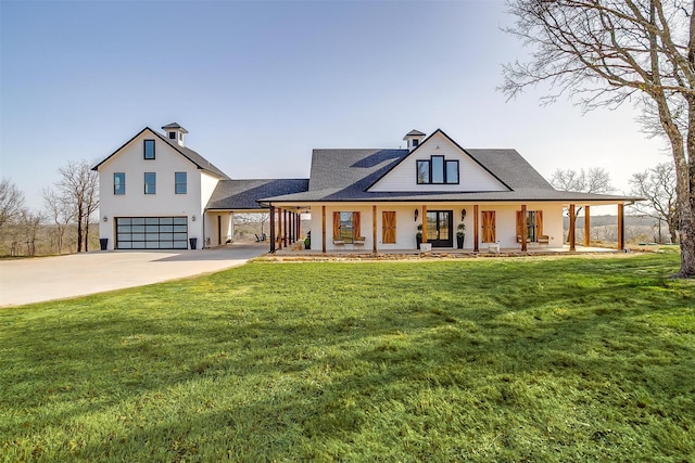 modern farmhouse style home featuring an attached garage, a porch, concrete driveway, and a front yard