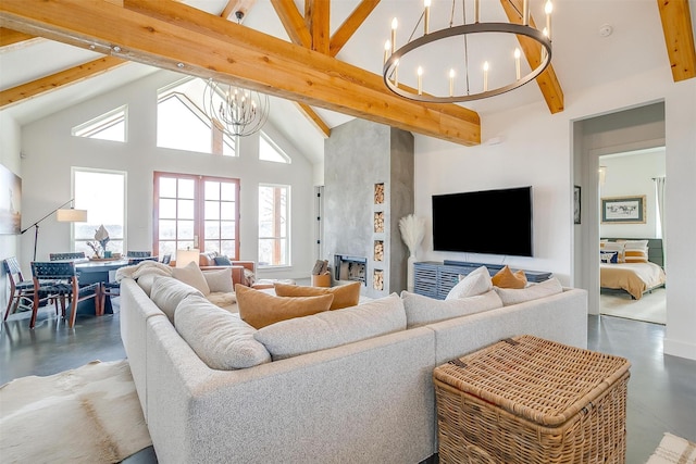 living area with beam ceiling, high vaulted ceiling, finished concrete flooring, and an inviting chandelier