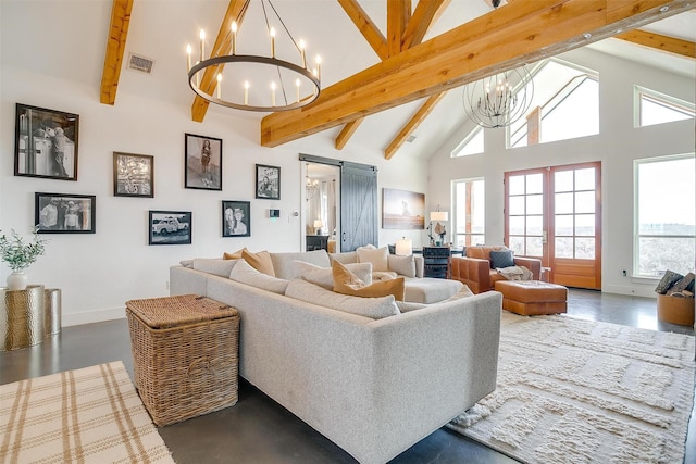 living room featuring visible vents, beam ceiling, a notable chandelier, high vaulted ceiling, and a barn door