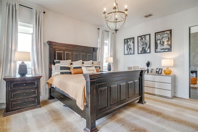 bedroom with visible vents, concrete floors, and an inviting chandelier