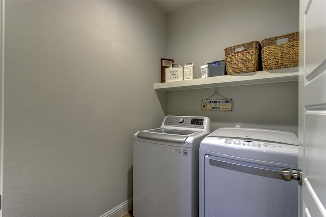 washroom with laundry area and washer and clothes dryer