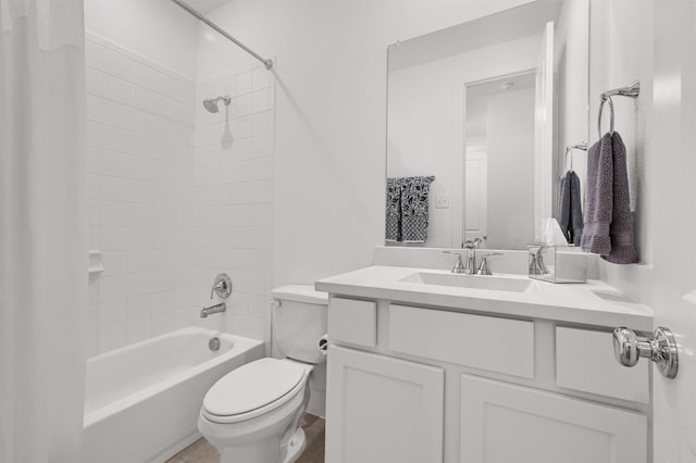 bathroom featuring vanity, toilet, and shower / bathtub combination with curtain