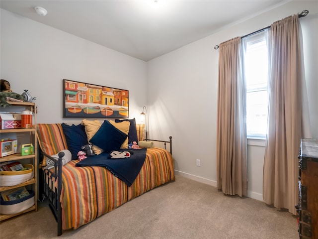 carpeted bedroom with baseboards