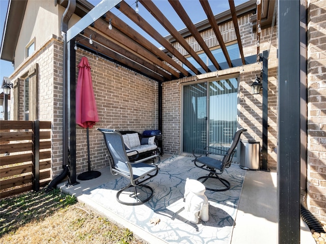 view of patio featuring fence