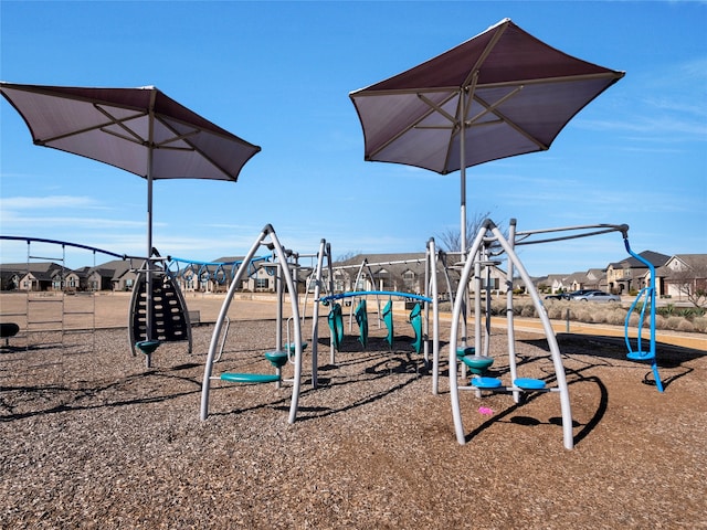 community jungle gym featuring a residential view