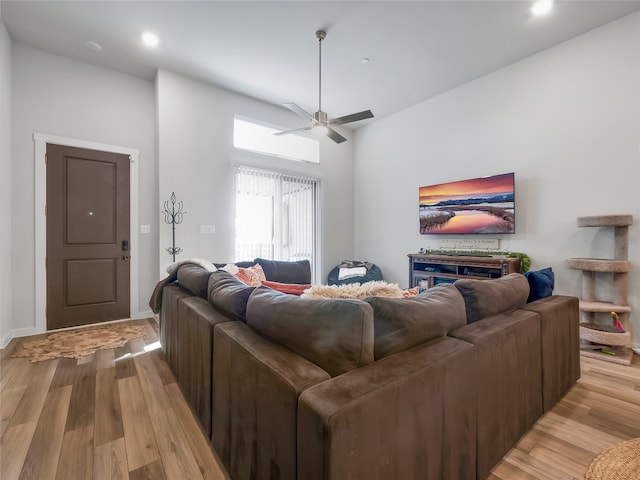 living room with ceiling fan, light wood-type flooring, and recessed lighting