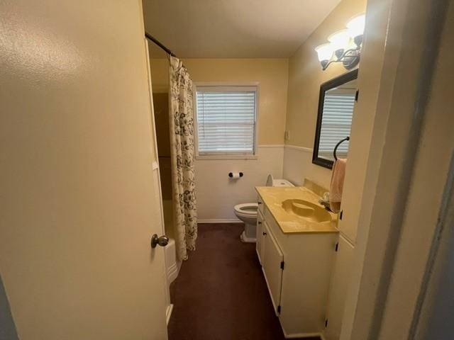 bathroom with vanity, toilet, and a shower with curtain