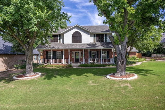9705 Whitney Ct, Granbury, TX 76049 - view of front of property featuring brick siding, a front yard, and covered porch