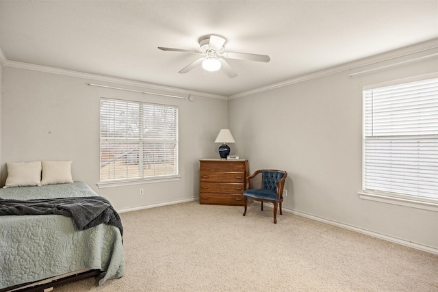 bedroom with carpet, crown molding, baseboards, and ceiling fan