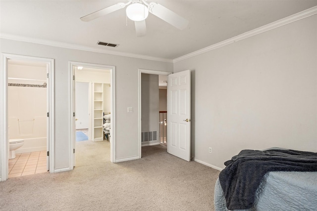 bedroom with crown molding, baseboards, visible vents, and light colored carpet