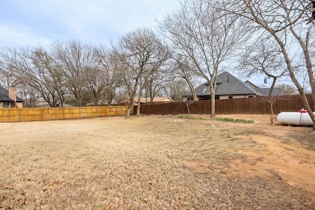 view of yard with a fenced backyard