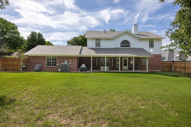 9705 Whitney Ct, Granbury, TX 76049 - rear view of property featuring brick siding, a patio area, central AC unit, and a chimney