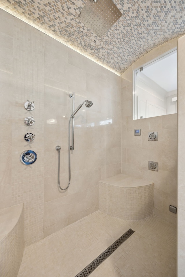 full bath with tiled shower