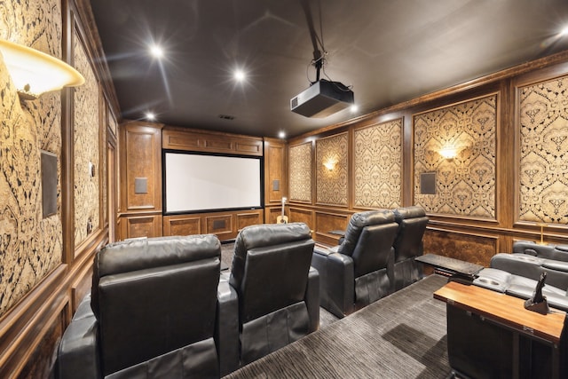 home theater room featuring a decorative wall and recessed lighting