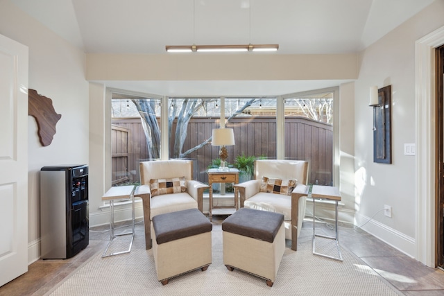 sitting room with heating unit and baseboards