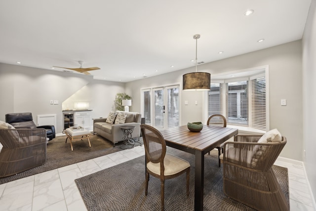 dining area with wine cooler, recessed lighting, a ceiling fan, baseboards, and marble finish floor