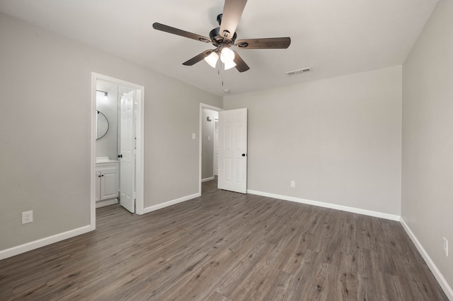 unfurnished bedroom with wood finished floors, a ceiling fan, and baseboards