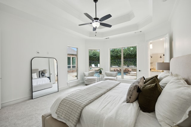 bedroom featuring a raised ceiling, light colored carpet, visible vents, ornamental molding, and baseboards