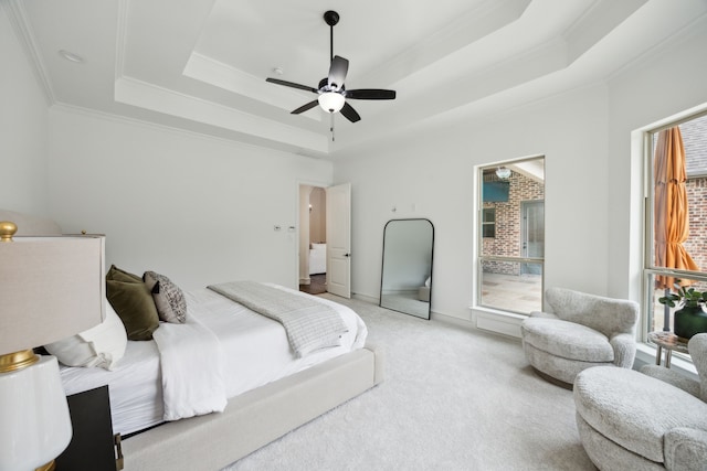 bedroom with ornamental molding, a raised ceiling, light carpet, and multiple windows