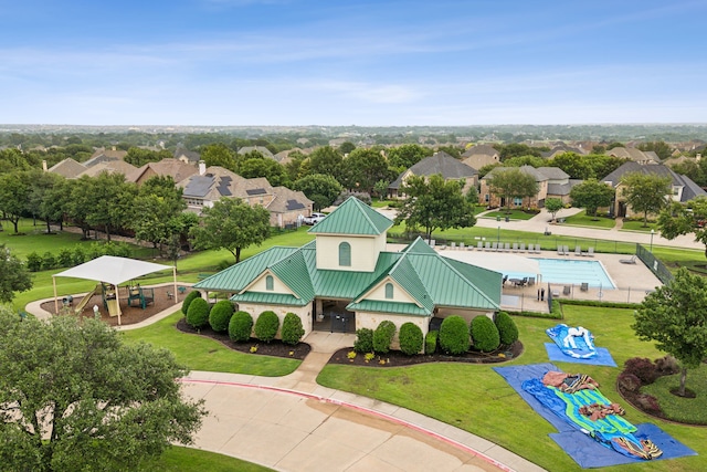 birds eye view of property with a residential view