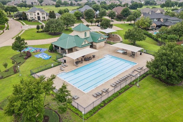 pool featuring a residential view and fence