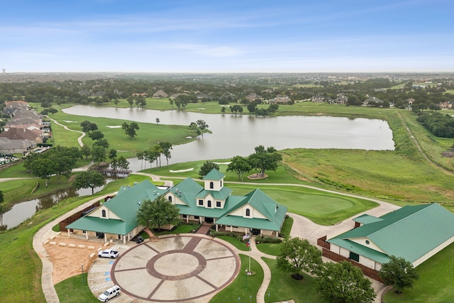 bird's eye view featuring a water view and view of golf course