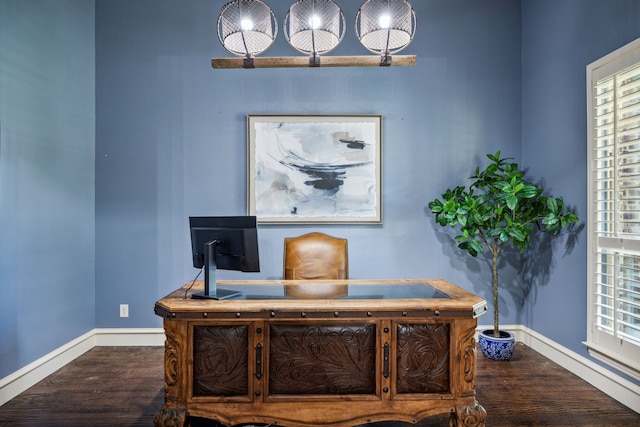 office area featuring baseboards and wood finished floors