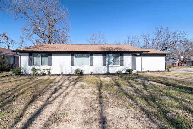 rear view of property with a yard