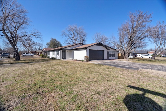 view of home's exterior with a garage, stucco siding, concrete driveway, and a yard