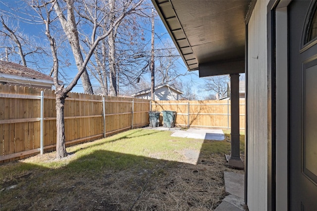 view of yard with a fenced backyard