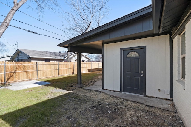 exterior space with a patio area, fence, and a lawn