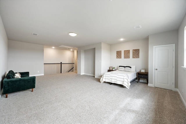 bedroom with carpet, visible vents, and baseboards