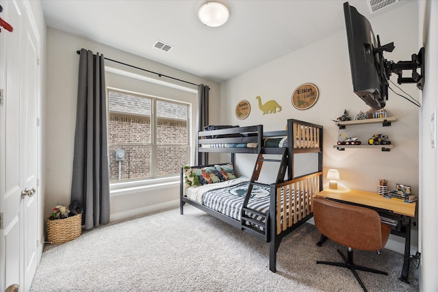 carpeted bedroom with visible vents and baseboards