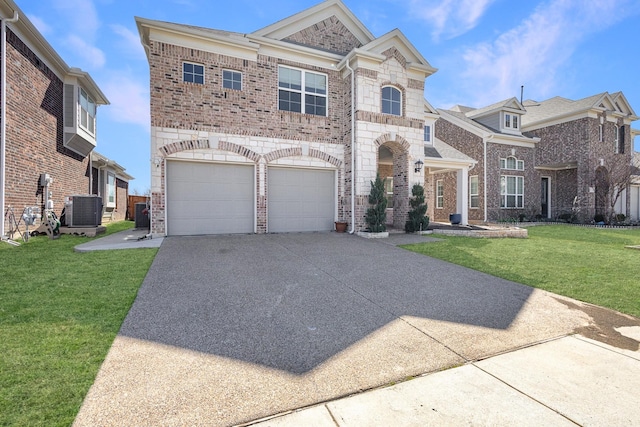 view of front of home with brick siding, a garage, cooling unit, driveway, and a front lawn