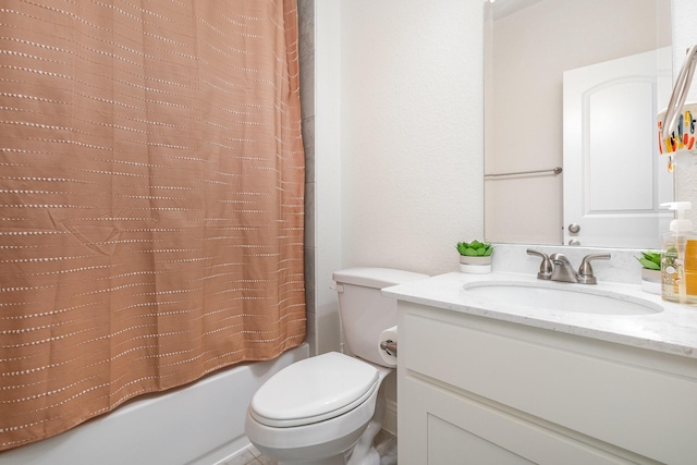 bathroom featuring toilet, shower / tub combo, and vanity