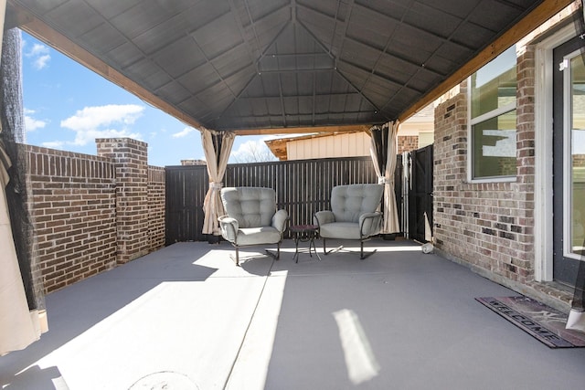 view of patio / terrace featuring fence and a gazebo