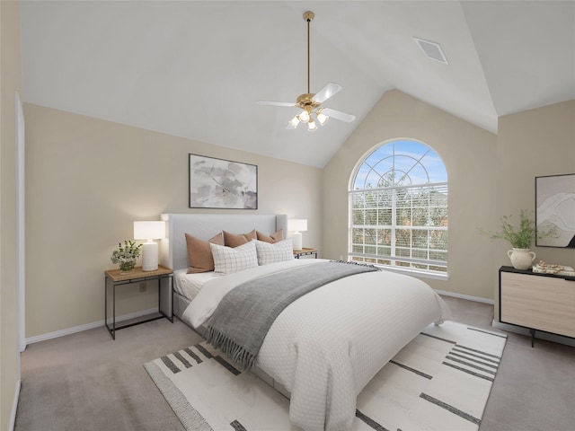 bedroom featuring lofted ceiling, baseboards, visible vents, and light colored carpet