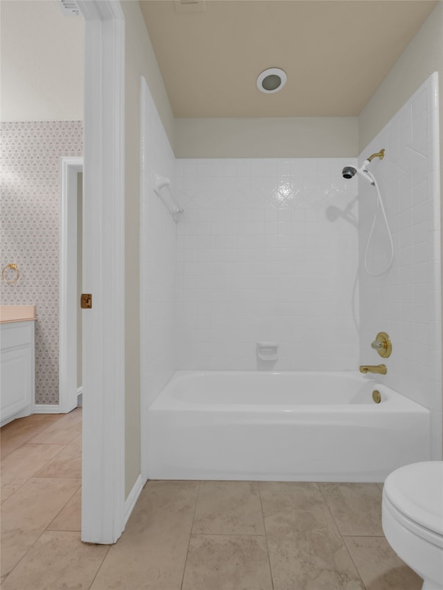 bathroom featuring wallpapered walls, toilet,  shower combination, tile patterned flooring, and vanity