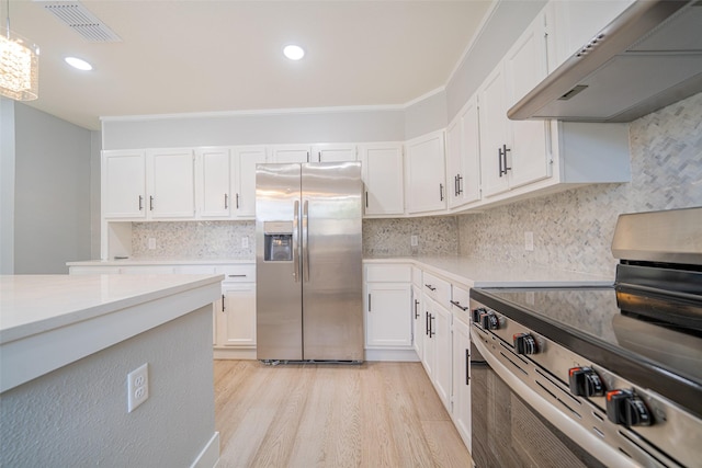 kitchen featuring under cabinet range hood, stainless steel appliances, white cabinetry, visible vents, and light countertops