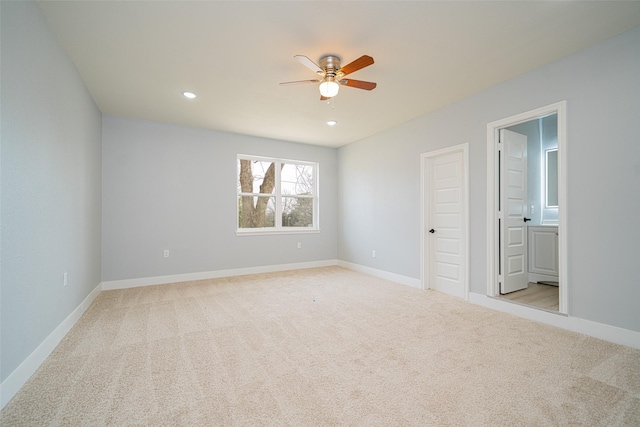 empty room featuring recessed lighting, light carpet, ceiling fan, and baseboards